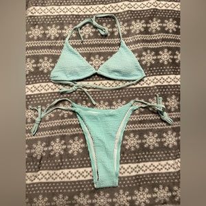 Light blue bikini never worn! XS TOP & M BOTTOMS!